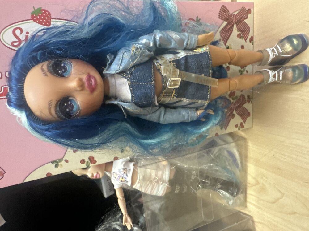 Blue-Haired Fashion Doll In Denim Layers