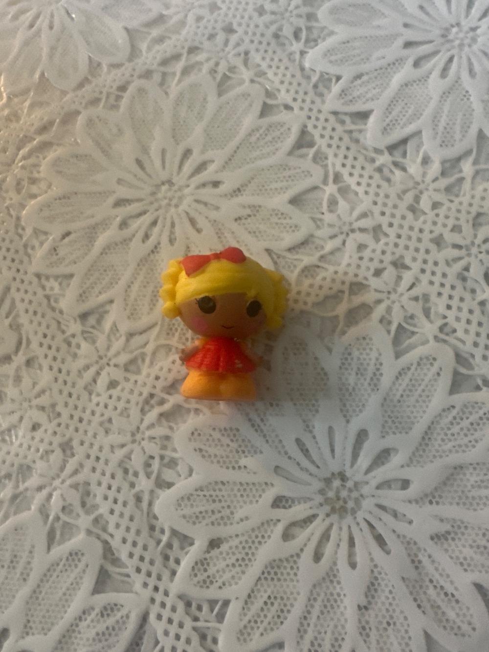 Tiny Blonde Doll Figure With Red Bow
