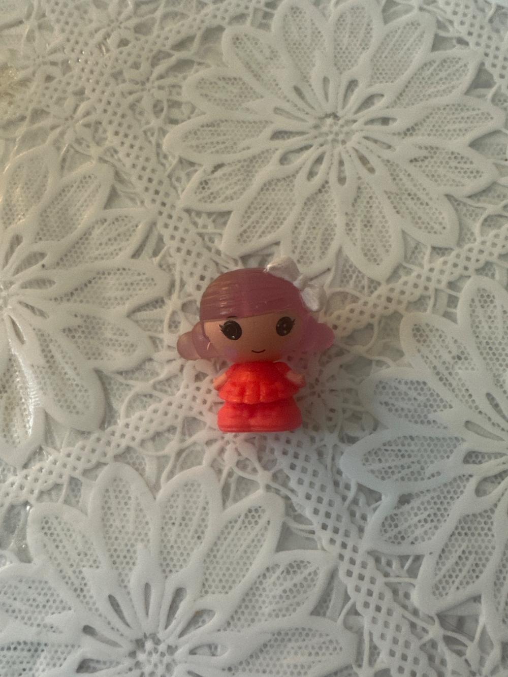 Tiny Girl Figure in Red Dress