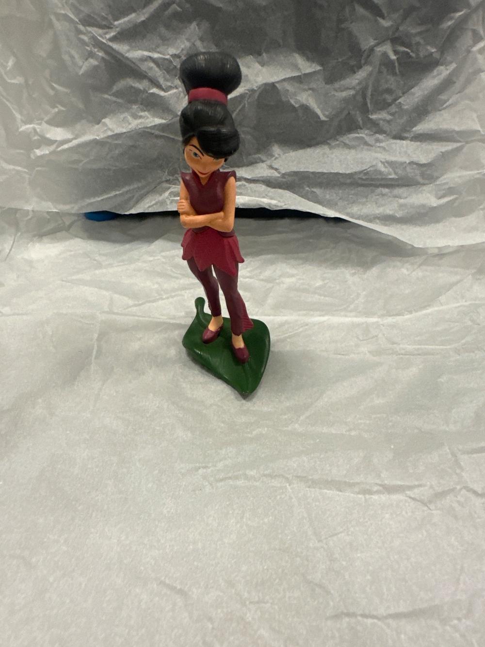 Fairy Figure With Updo Hair On Leaf Base