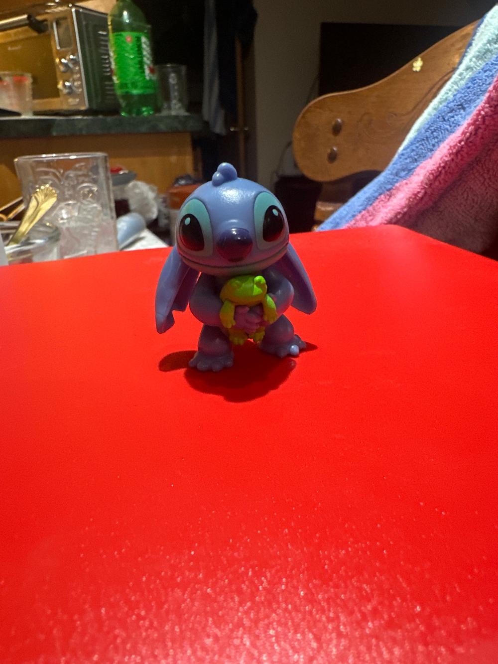 Stitch Figure Holding Frog