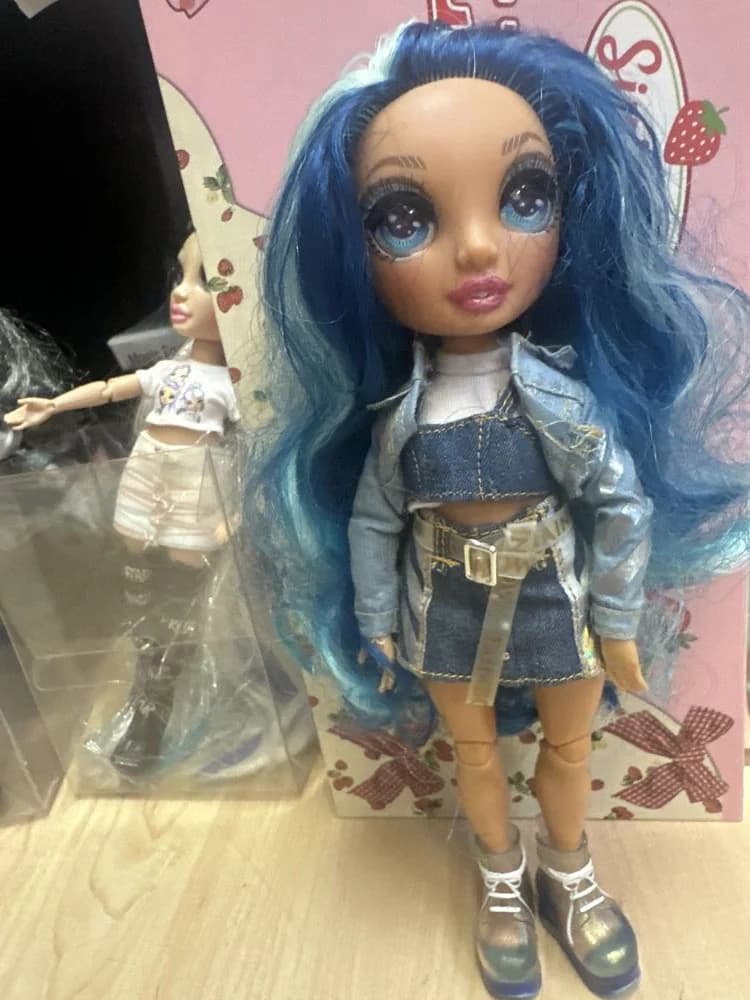 Blue-Haired Fashion Doll In Denim Layers
