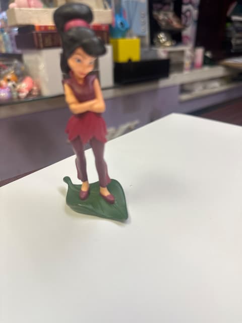 Fairy Figurine In Burgundy On Leaf Base