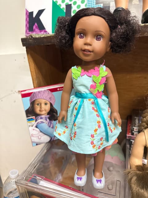 Curly-Haired Doll in Turquoise Floral Dress