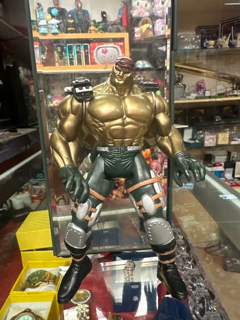 Oversized Gold Muscular Action Figure