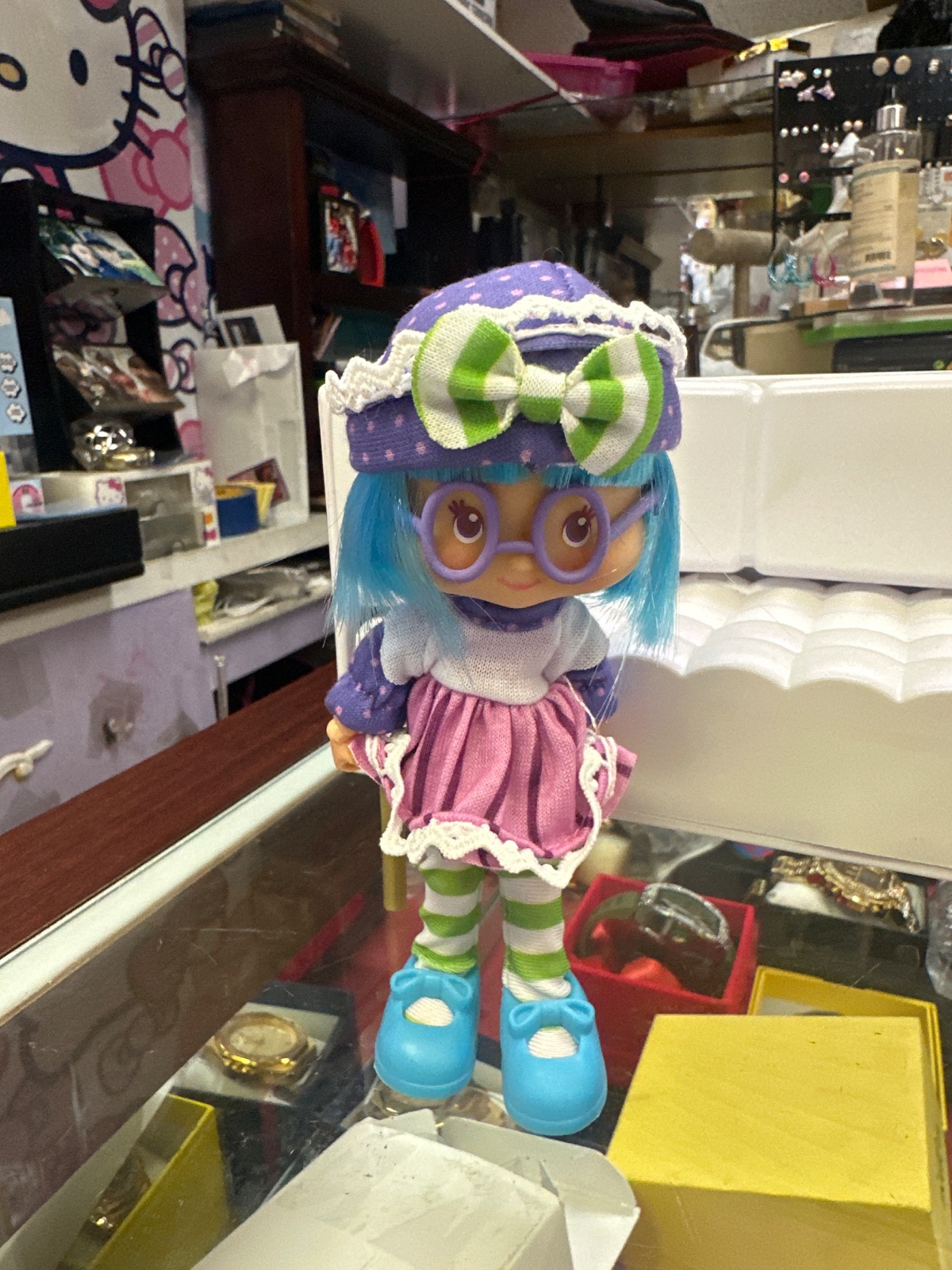 Blue Haired Doll With Purple Glasses And Bow Hat