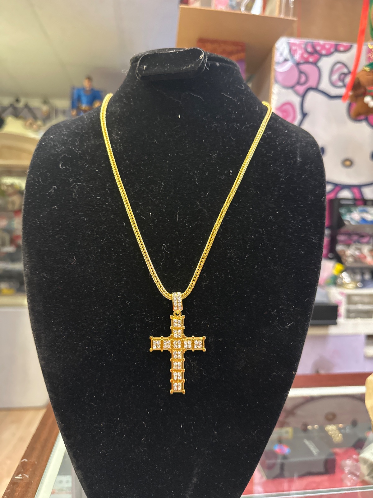 Gold-Tone Cross Pendant Necklace with Baguette Stones