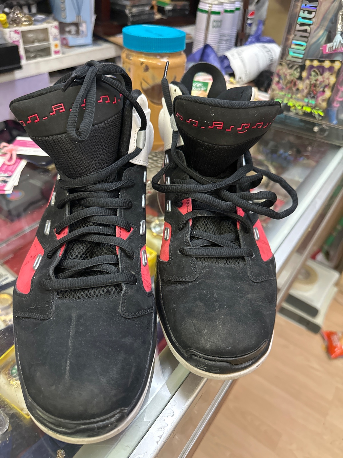 Black High-Top Sneakers with Red Music Note Detail