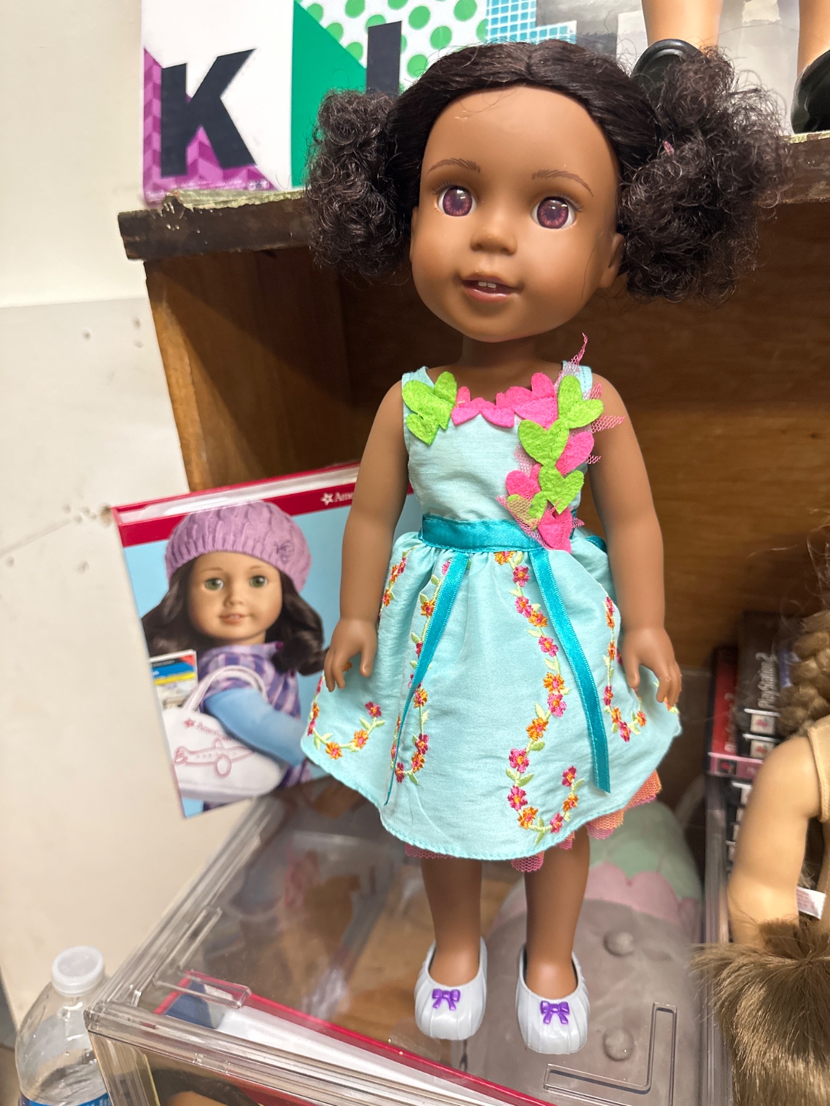 Curly-Haired Doll in Turquoise Floral Dress