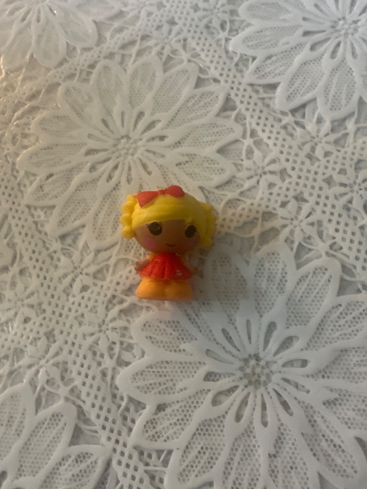 Tiny Blonde Doll Figure With Red Bow