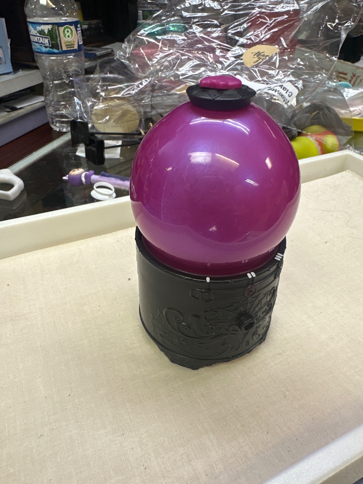 Purple Crystal Ball Toy on Ornate Black Base