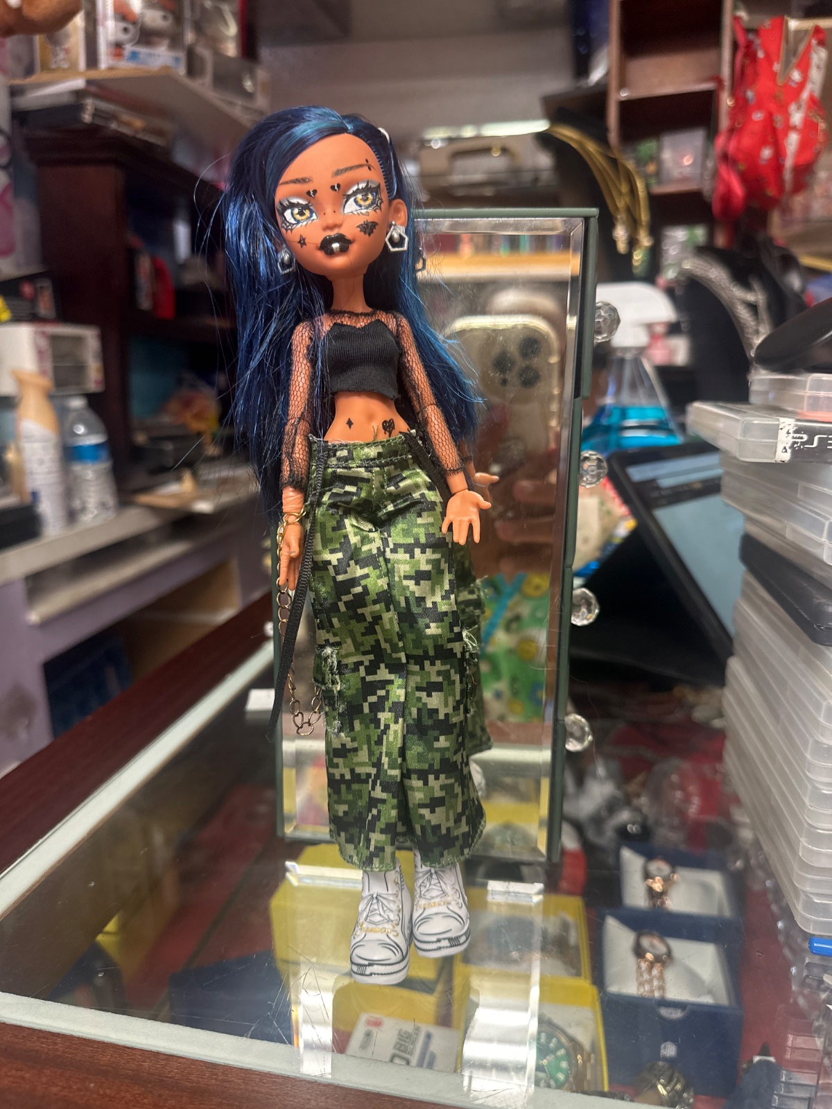 Blue-Haired Fashion Doll With Star Makeup And Camo Pants
